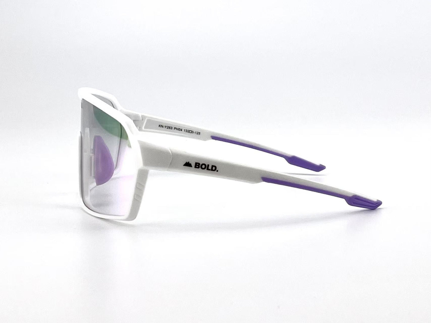 BOLD Drift Photochromic Sunglasses by boldouterwear feature a modern, angular white frame with purple arm accents, mirrored lenses, and black “BOLD.” branding. Light-adaptive and perfect for MTB, ski, or lifestyle wear. Set against a plain white background.