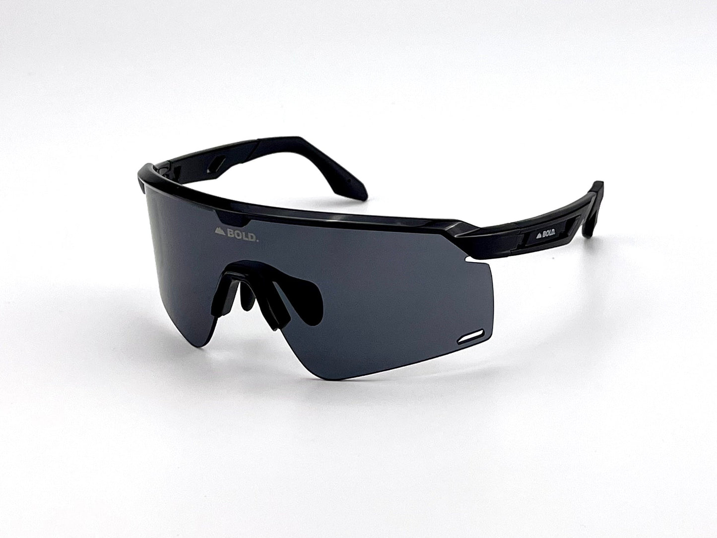 Sleek black BOLD Bearclaw Performance Sunglasses from boldouterwear feature an oversized shield design, a single dark-tinted lens, black nose pads, and bold branding. Ideal for MTB, ski, and lifestyle wear.