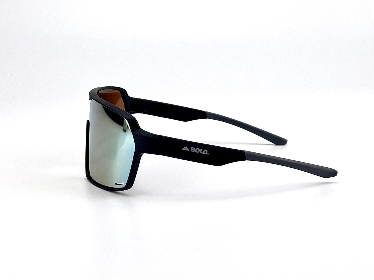 The BOLD Shadows Performance Sunglasses by boldouterwear feature black, rectangular frames, reflective fixed-tint lenses, and a white BOLD. logo on the left arm. The wraparound MTB, ski & lifestyle eyewear is shown on a plain white background.