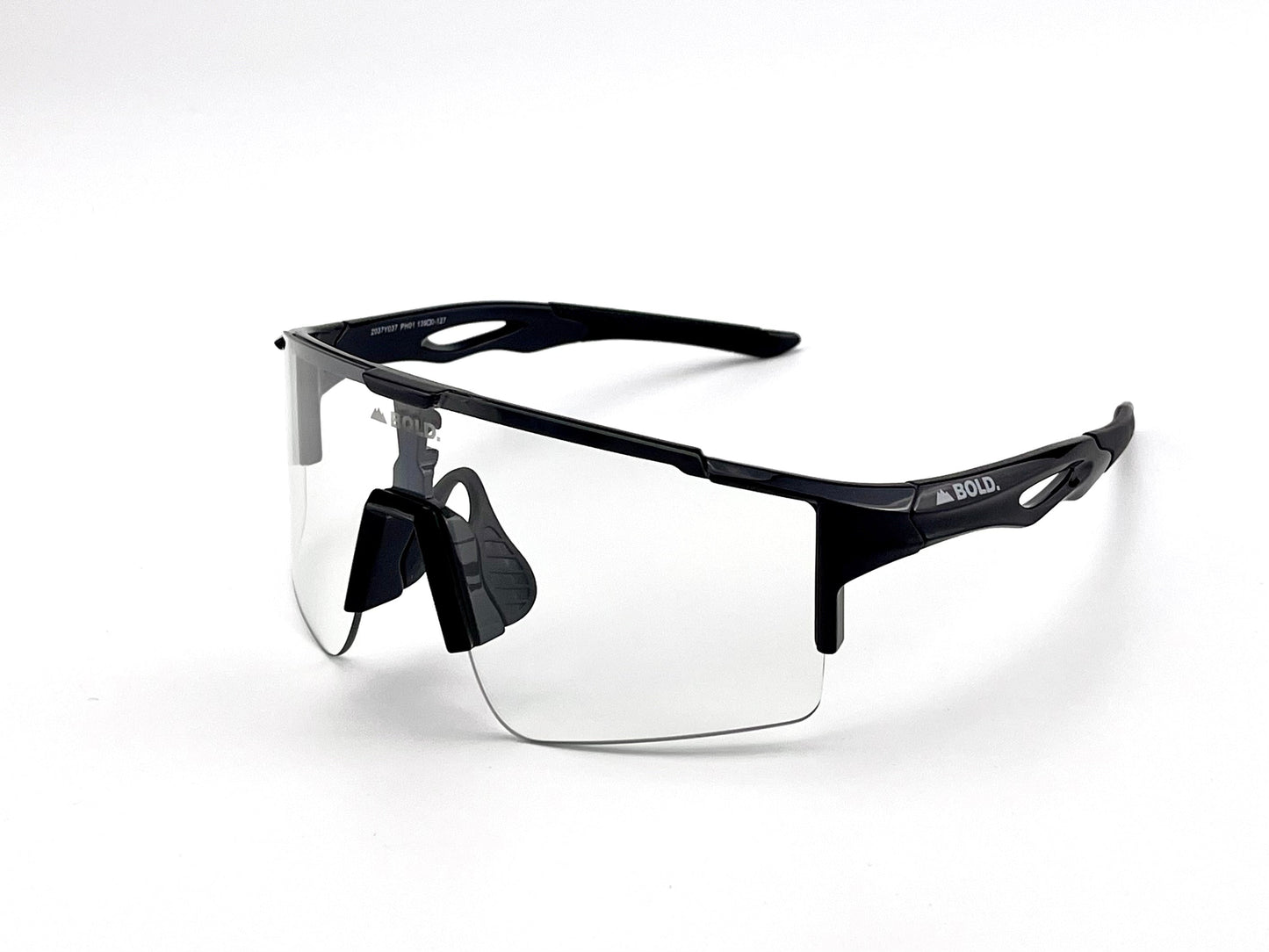 The BOLD Wavelength Performance Sunglasses by boldouterwear feature a black semi-rimless frame, clear wraparound lenses, adjustable nose pads, and “BOLD” on the left temple—perfect for athletes. Shown on a plain white background.