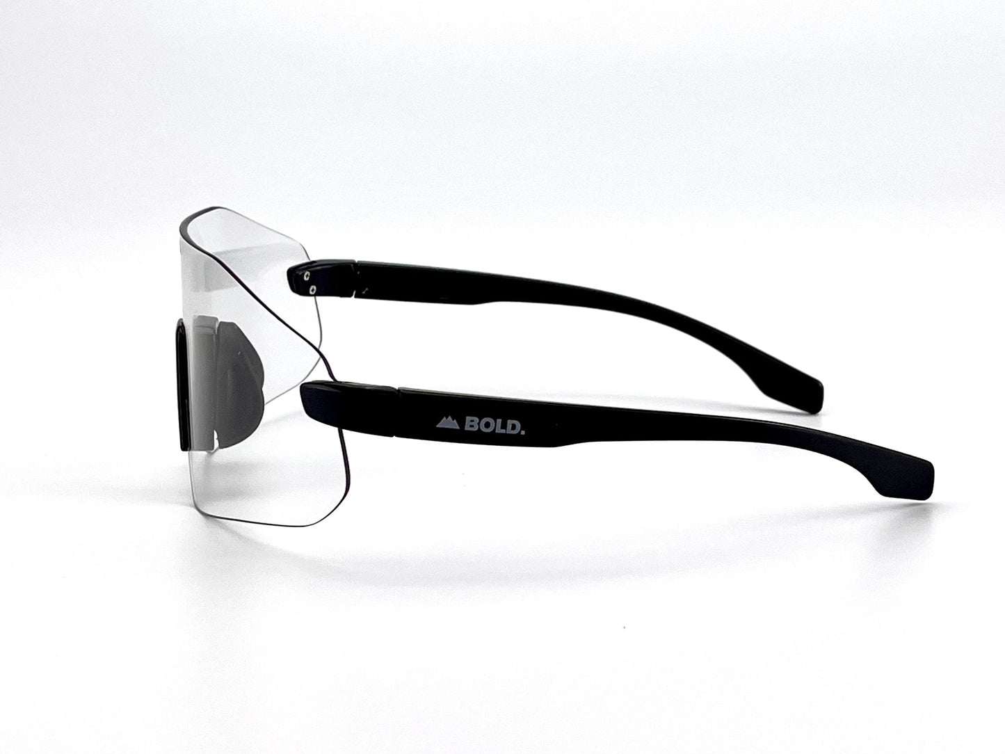 The BOLD Emerald Photochromic Sunglasses from boldouterwear feature a rimless lens, thick black arms (left arm labeled BOLD. with a mountain logo), and light-adaptive lenses—ideal for MTB, ski, and lifestyle use. Shown on a plain white background.
