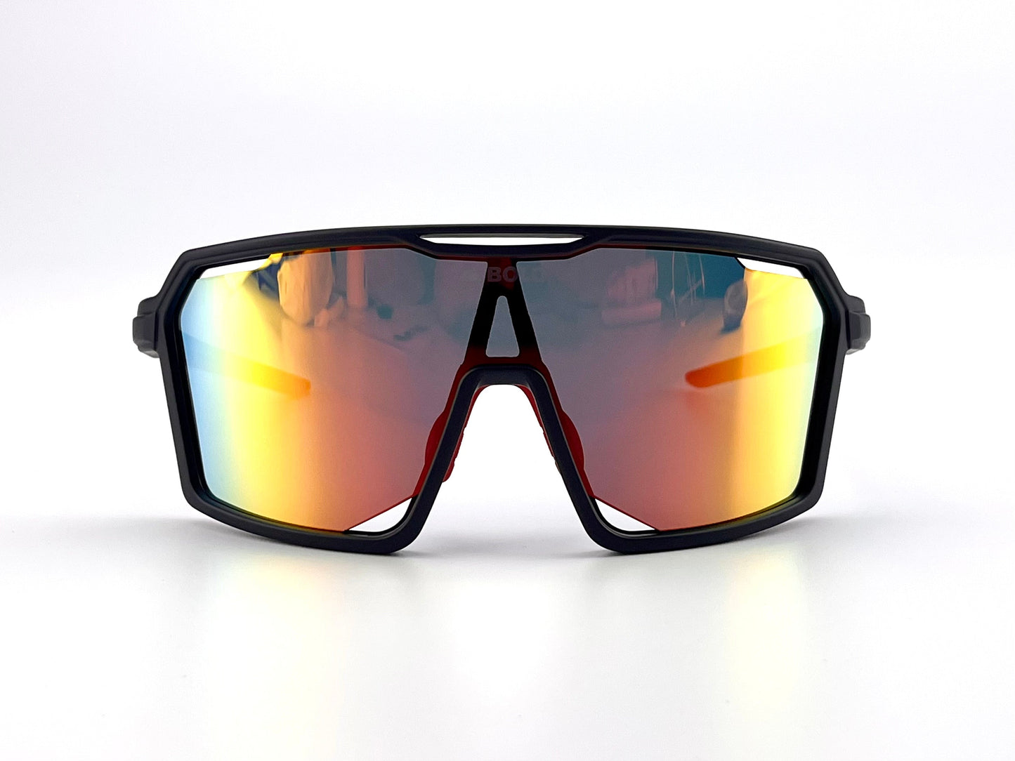 The BOLD Flux Performance Sunglasses by boldouterwear feature a black angular wraparound frame and large mirrored orange-red lenses with UV protection, designed for MTB, ski, and lifestyle use—shown against a plain white background.