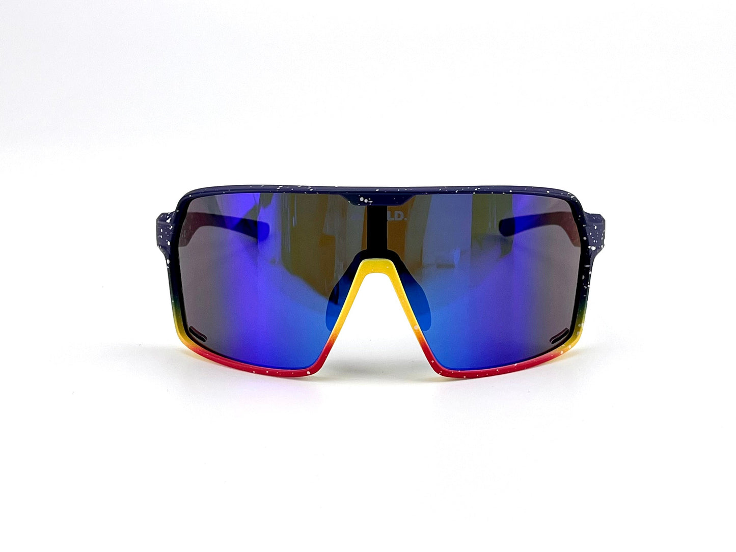 Front view of BOLD Shadows Performance Sunglasses by boldouterwear, with a single large blue-purple mirrored lens, black frame with white speckles fading to yellow and red at the nose bridge, set against a plain white background.