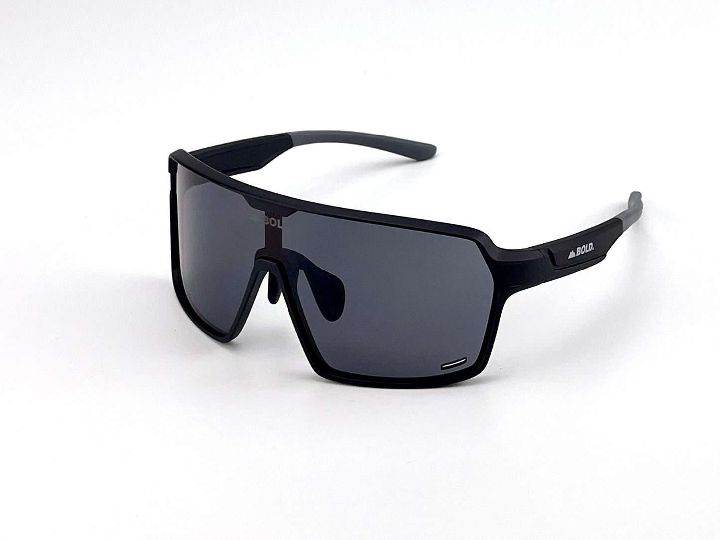 A pair of BOLD Shadows Performance Sunglasses by boldouterwear, featuring large matte black rectangular fixed-tint lenses, a thick frame, and logo detailing on the left lens and arm, set against a plain white background.