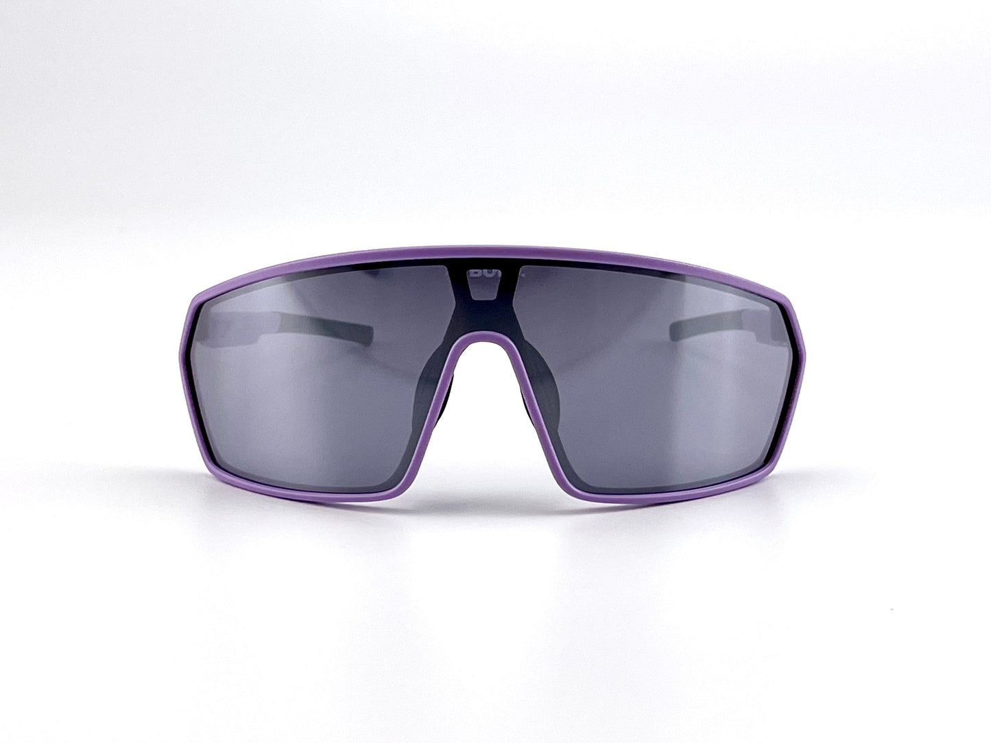 The BOLD NSP Performance Sunglasses from boldouterwear feature a large, sporty purple frame with dark, reflective lenses. Designed for MTB, ski, and lifestyle use, they offer modern wraparound coverage and are shown facing forward on a white background.