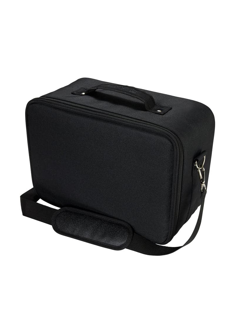 The ZUCA Tech Case is a black case with a smooth hard plastic mold, zipper closure, padded top handle, adjustable shoulder strap with metal clasps, and interior padded dividers for organization. The bag is shown against a white background.