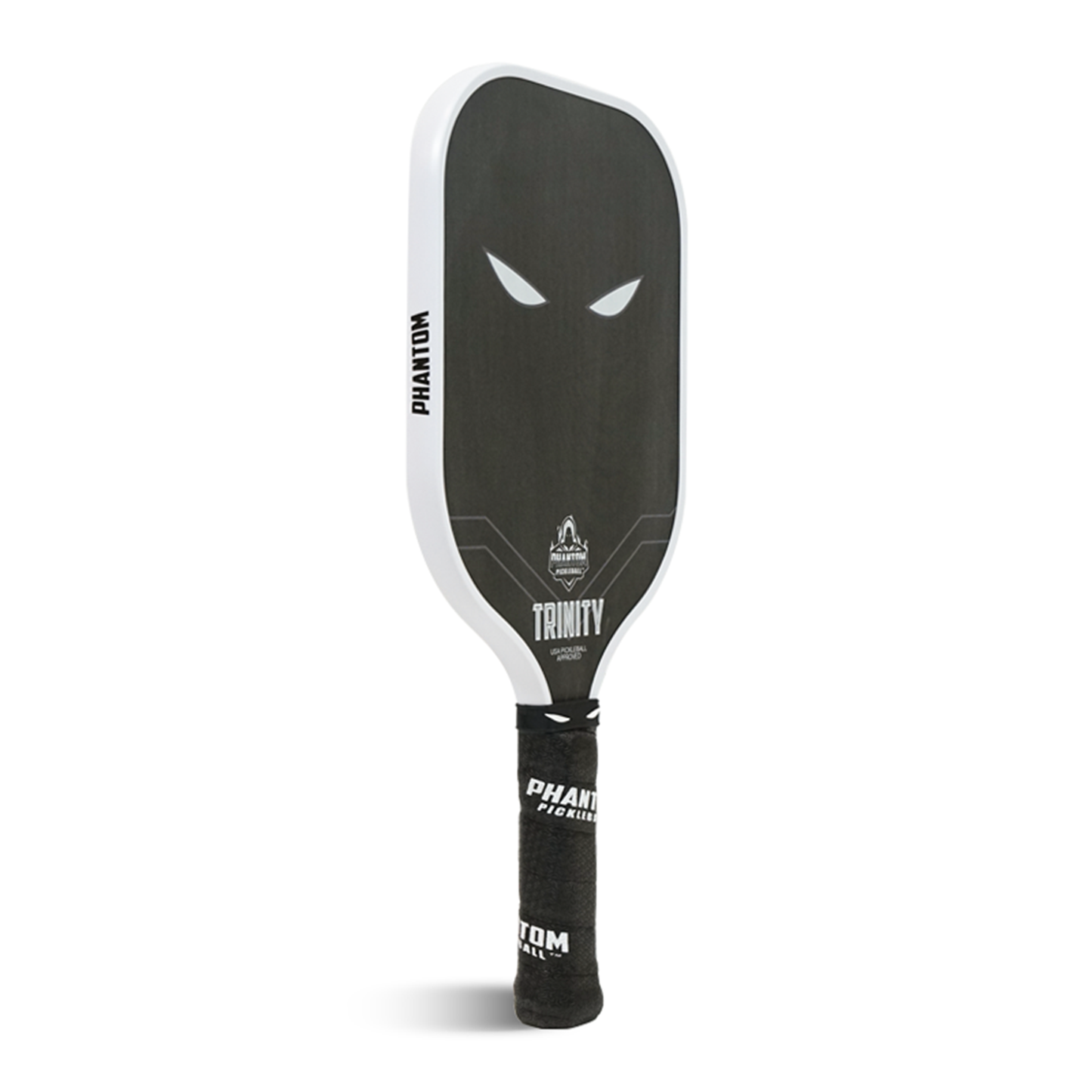 The Phantom TRINITY 14MM T700 Raw Carbon Fiber Pickleball Paddle by Phantom Pickleball features a black design with white edge, menacing eyes graphic, "TRINITY" and logo near the throat, and a black handle with white text—part of the advanced response series.