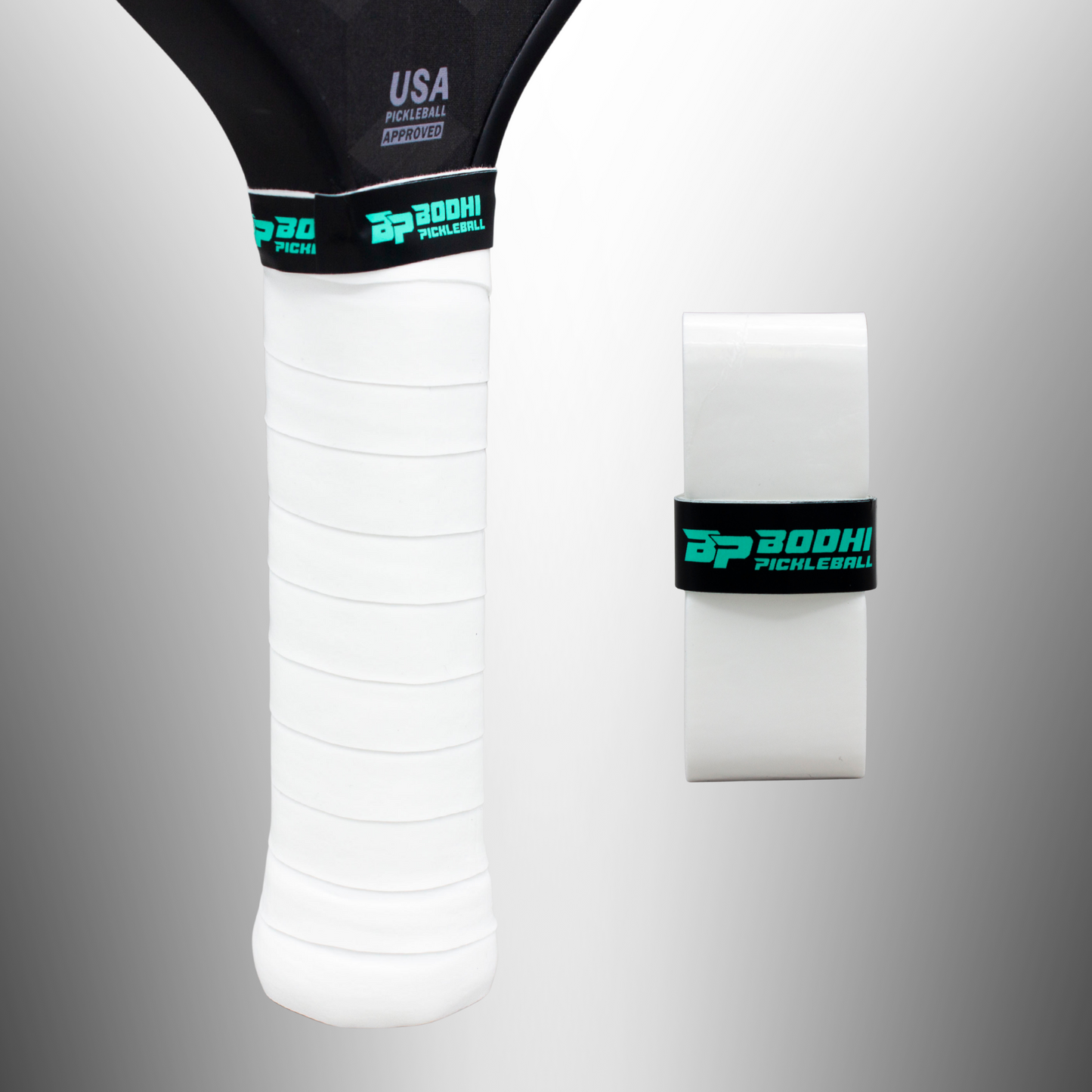 Close-up of a Bodhi Performance PROtack™ Premium Pickleball Overgrip, installed and secured with a black and teal branded band, beside an unused white overgrip wrapped with the same band on a gray gradient background.