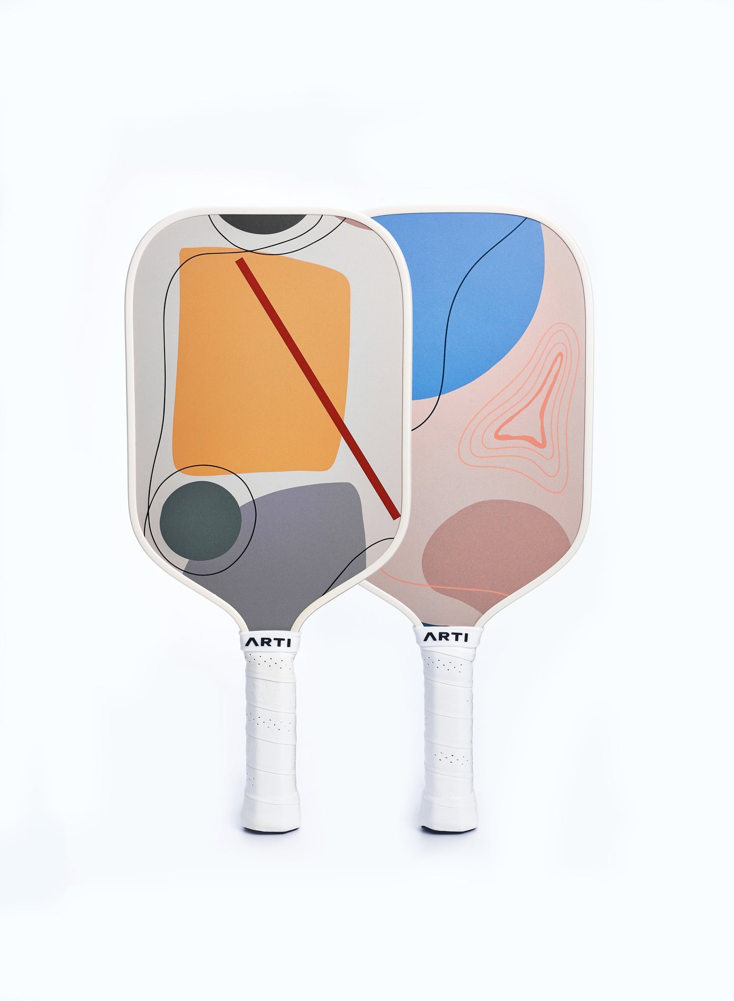 Two ARTI Fiberglass "Horizon Duo" USAPA-approved pickleball paddles stand upright against a white background, each lightweight paddle featuring abstract geometric designs in blue, orange, gray, pink, and red with white grip tape on the handles.