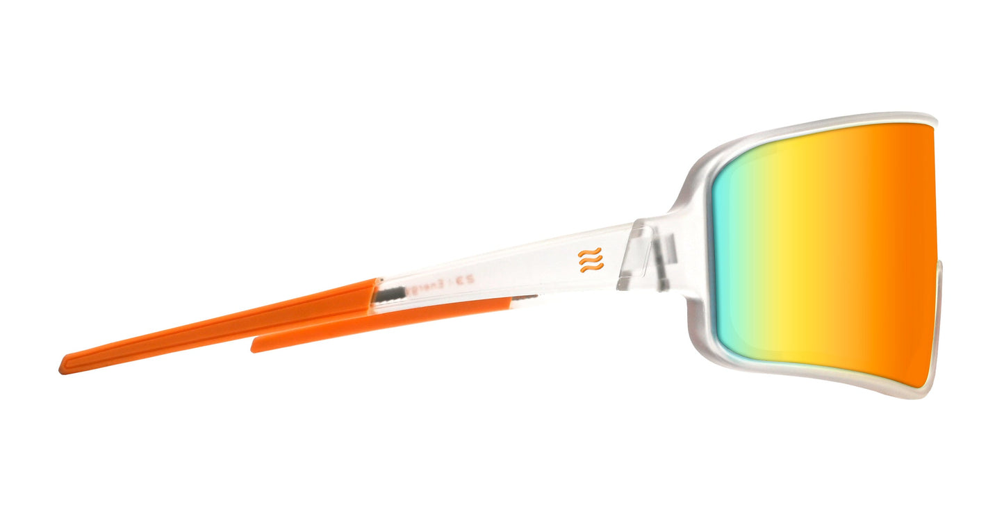 Side view of Neven Eyewear's Energy shades, featuring a transparent frame, bright orange arms, and a large curved lens with reflective yellow-orange to blue gradient tint for a bold modern look.