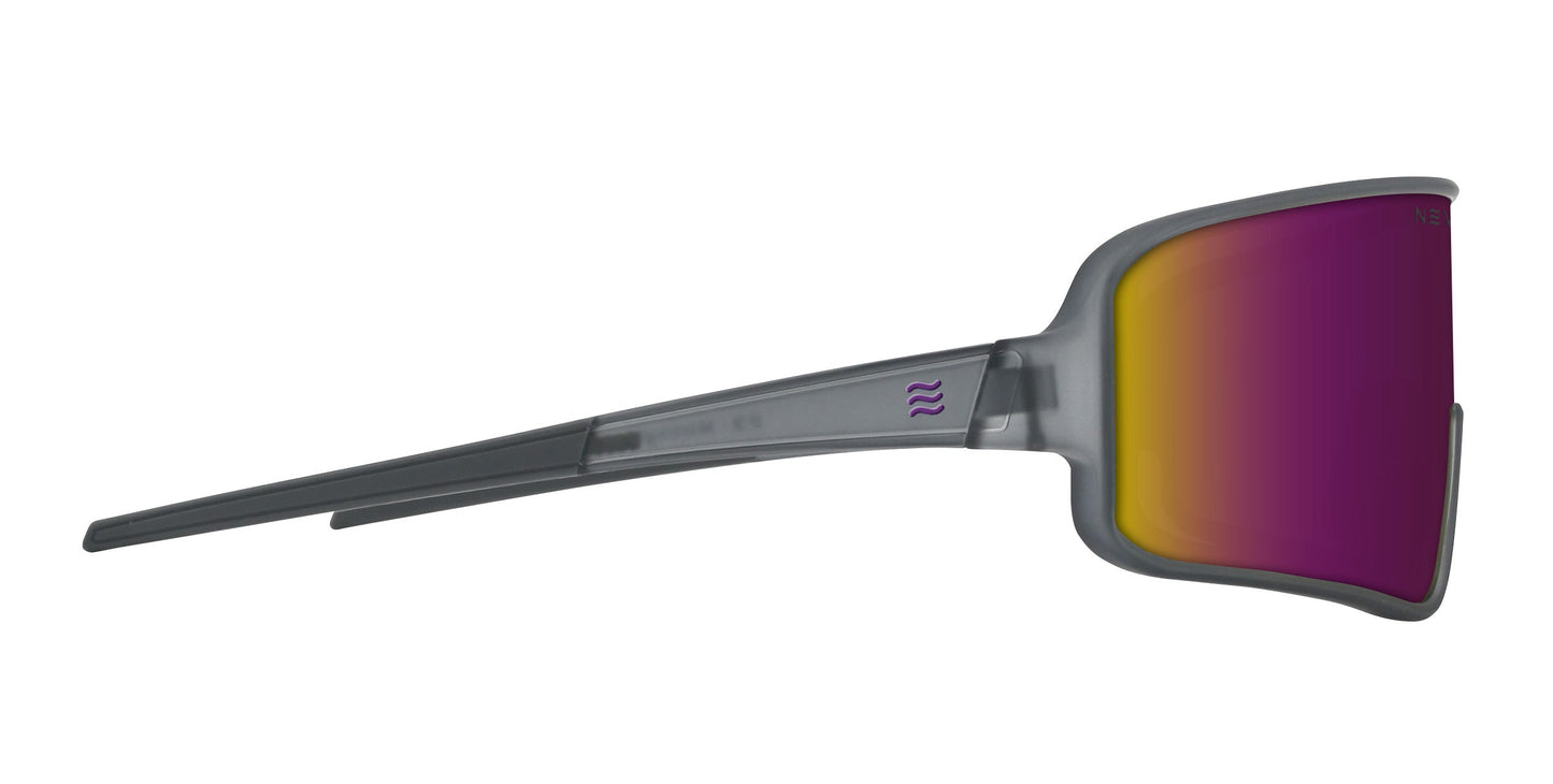 A side view of the Neven Eyewear Mattingly sunglasses shows a translucent gray frame and a single wide wraparound lens with a pink, yellow, and orange gradient mirror finish—ideal for vintage game style or catching Yankees action.