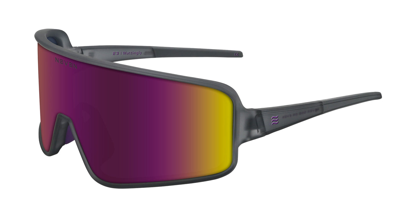 The Mattingly by Neven Eyewear is an oversized, wraparound sunglass with a matte gray frame and single shield lens. Its purple-to-yellow gradient evokes vintage baseball on AM radio, while the straight temples curve behind the ears.