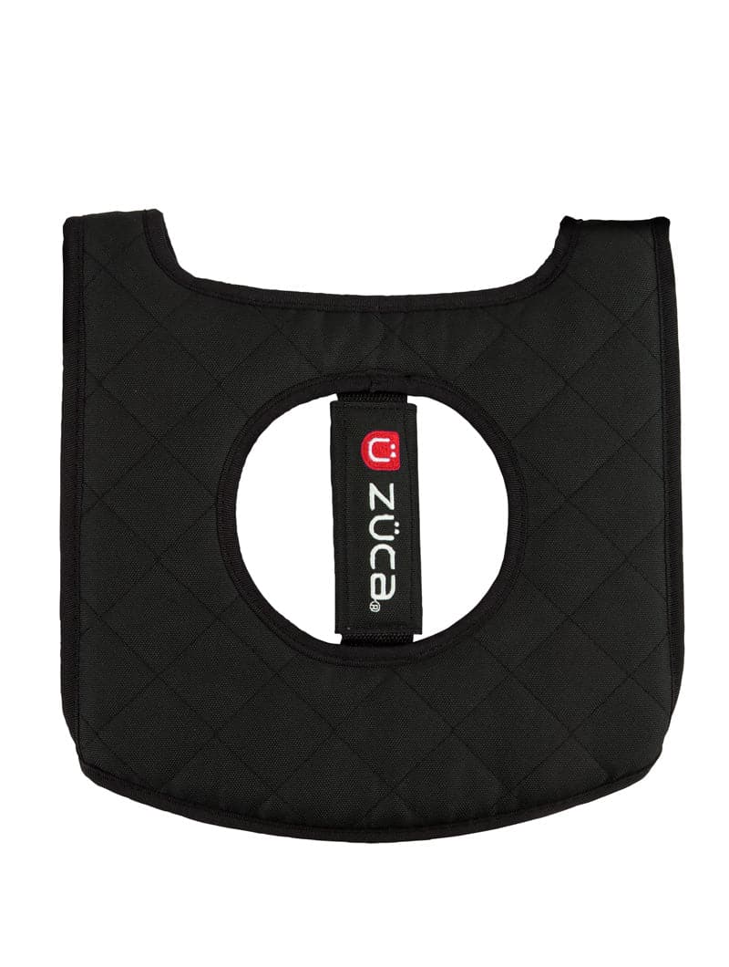 The ZUCA Reversible Seat Cushion is a black, quilted, square pad with rounded edges, a central circular cutout, and a branded strap. Its padded texture offers added comfort and protection for your seat.