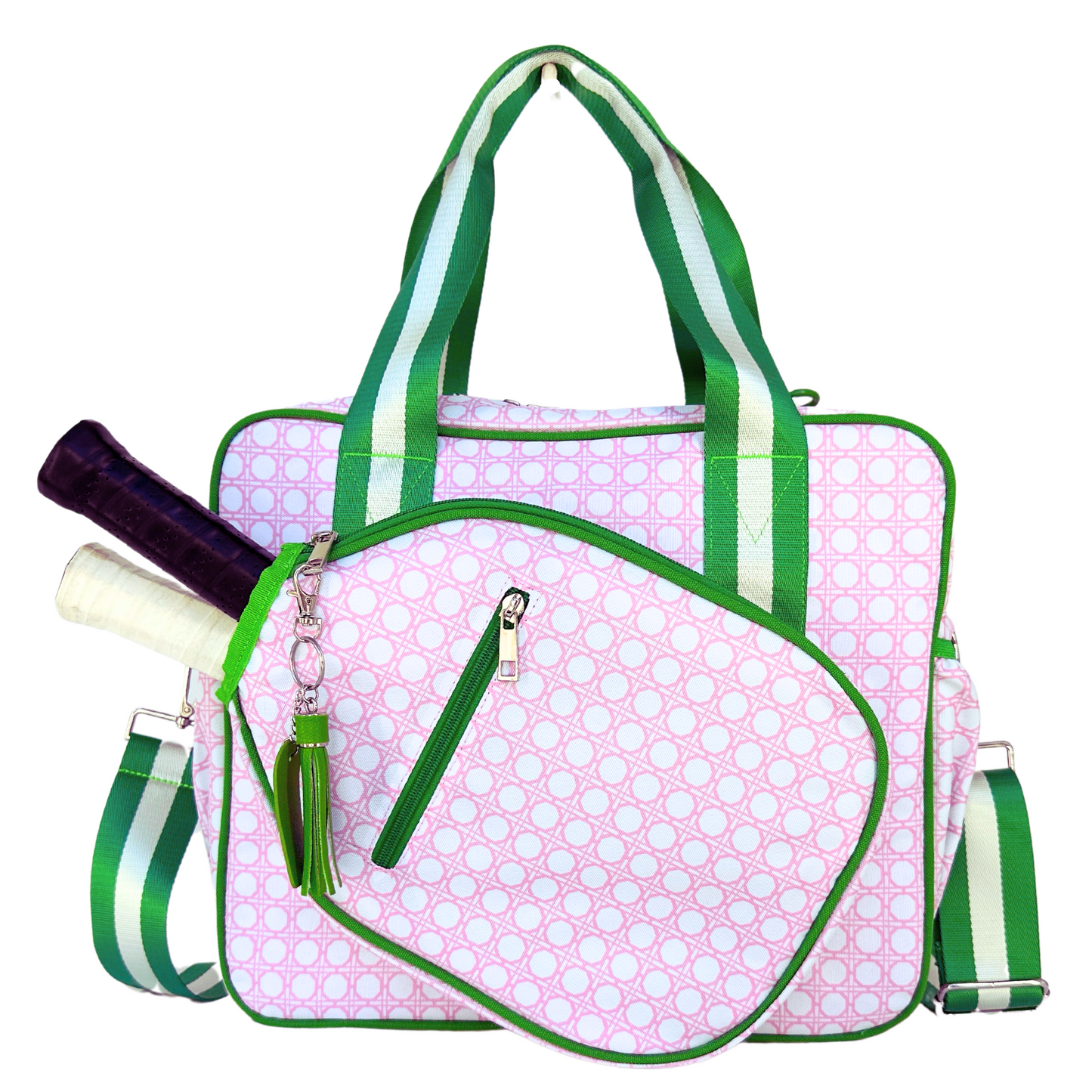 The Queen of the Court Prepster Pickleball Bag is a quilted pink and white bag with green trim, striped straps, front pocket for two racquets, small zip pocket, and a green tassel keychain—perfect for carrying stylish pickleball accessories.