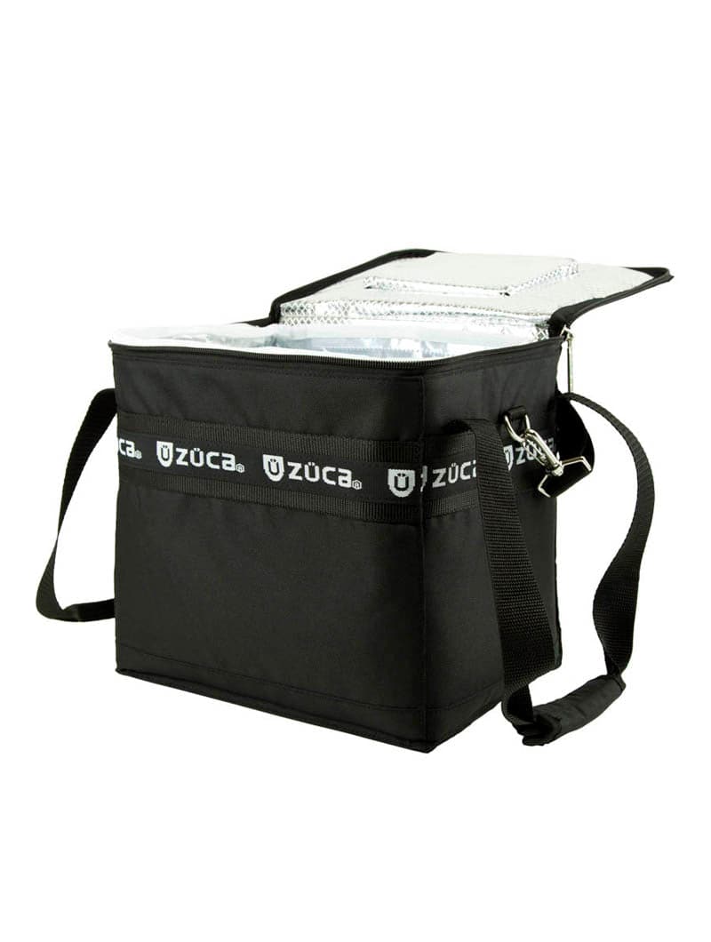 A black ZUCA Cooler bag with a shoulder strap and zippered top lid is open to show its silver insulated interior and mesh pocket inside the lid. The rectangular cooler with ice packs is displayed on a white background.
