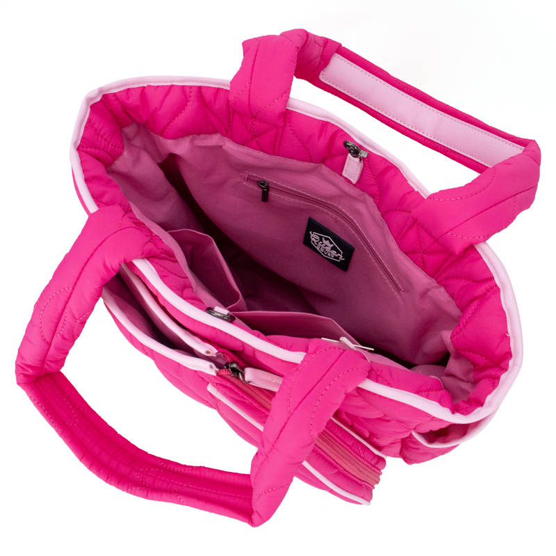 The Queen of the Court Park Ave Tennis Convertible Bag/Backpack is a stylish pink bag with zippers, perfect for carrying your gear to the court.