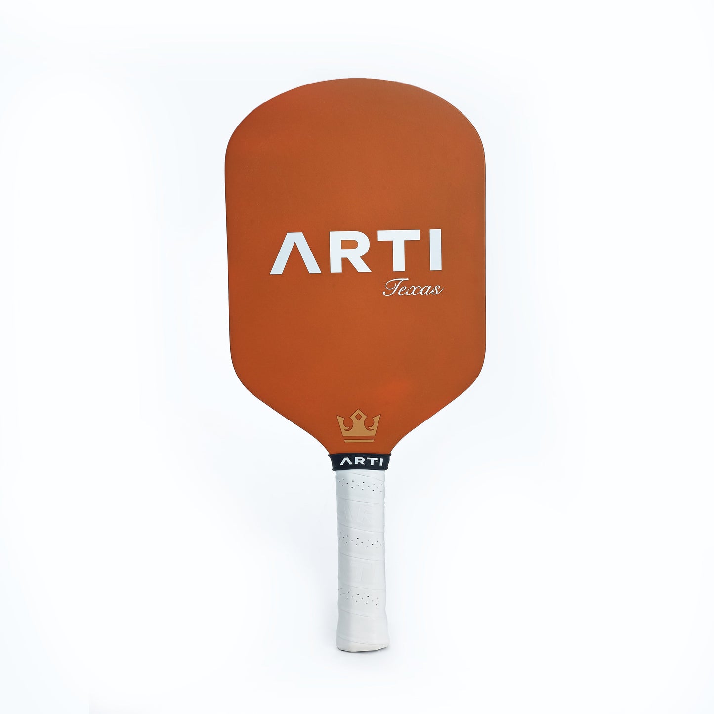 The ARTI Carbon Fiber "TEXAS" Paddle features a solid orange face with white ARTI and Texas text, white grip tape on the handle, and a gold crown ARTI logo above the handle. USAPA approved.