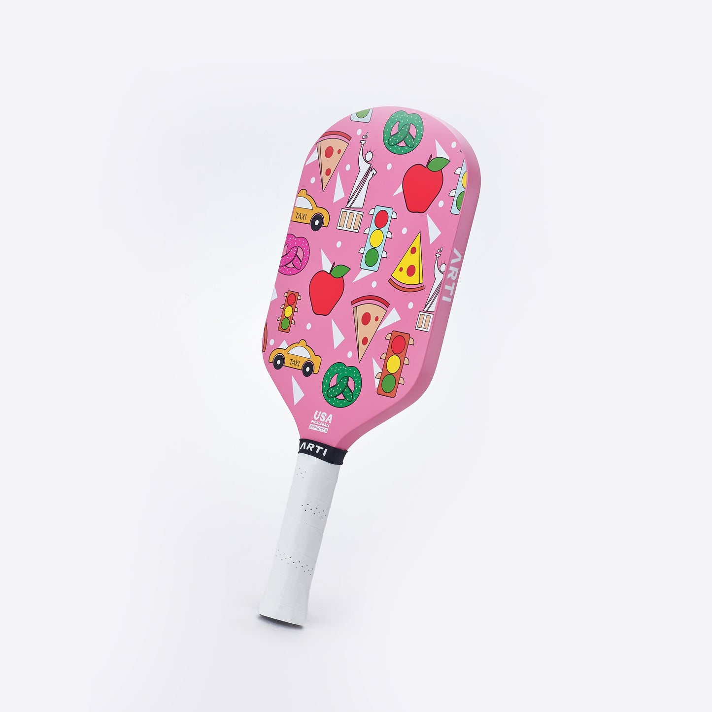 The ARTI Carbon Fiber "NEW YORK" paddle features a pink T700 carbon fiber face with vibrant New York-themed illustrations, a white handle, and "ARTI" on the neck. USAPA approved for competitive play.