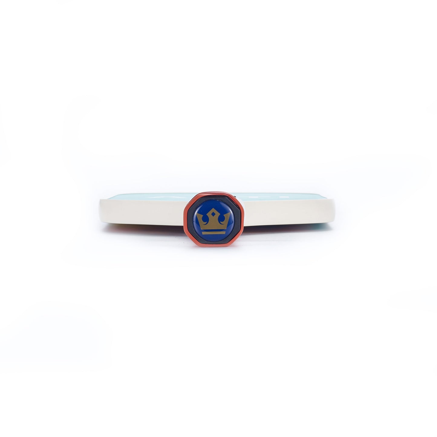 A round blue badge with a gold crown and red border stands upright before an ARTI Carbon Fiber Kristen & Kristy "IT'S PICKLE TIME" Paddle, which has light blue and white colors, all against a plain white background.