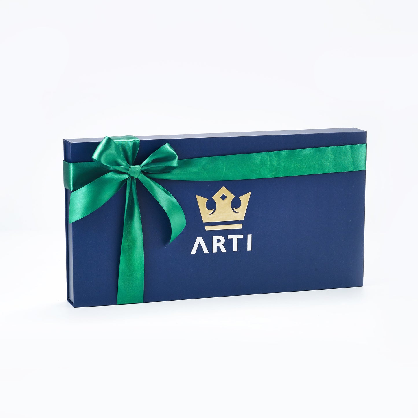 A navy blue rectangular gift box with a shiny green bow on the left and a gold crown above bold white ARTI letters, perfect for gifting the ARTI Carbon Fiber Kristen&Kristy "Happy Holidays" Paddle. Shown on a plain white background.