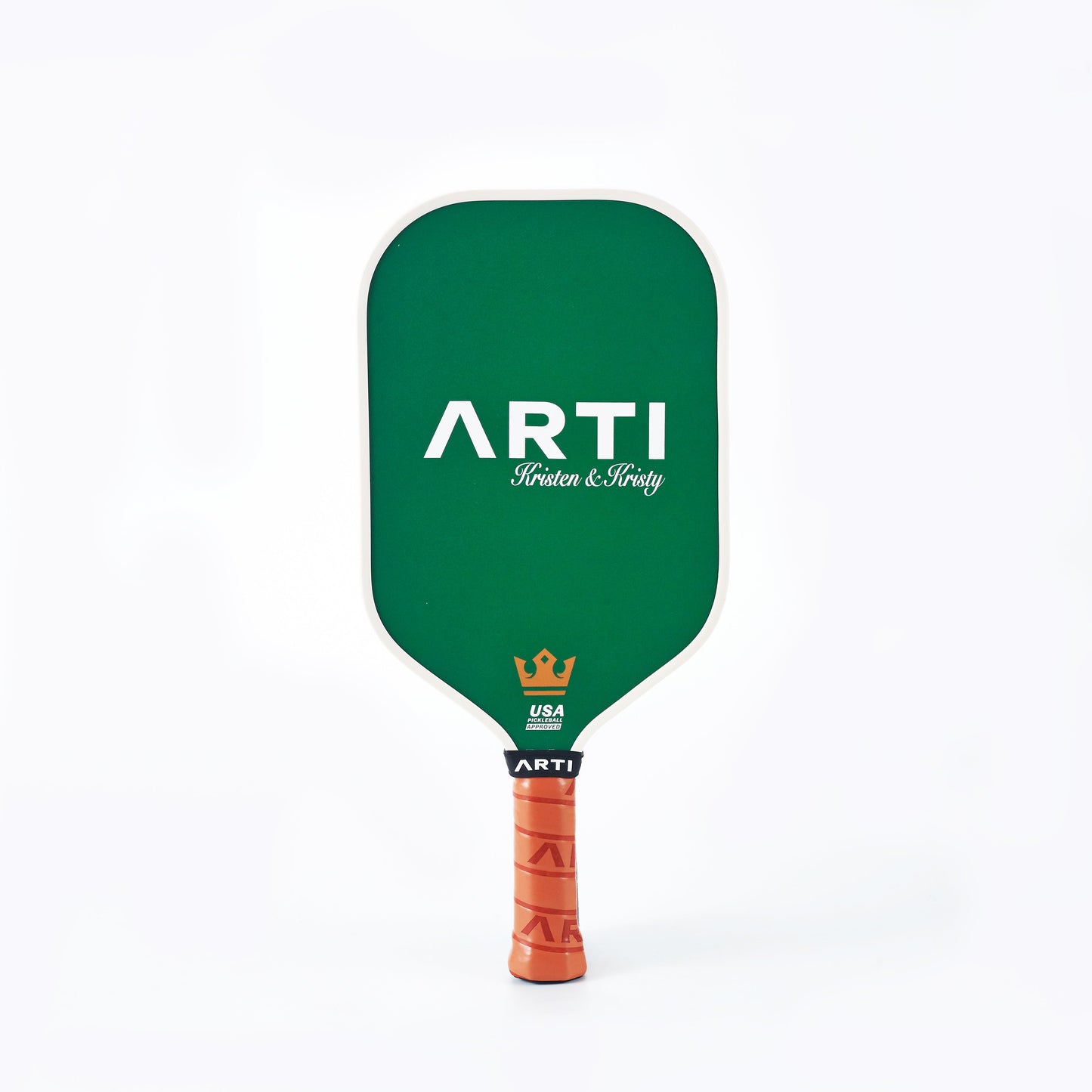 The ARTI Carbon Fiber Kristen&Kristy "Happy Holidays" Paddle features green T700 carbon fiber, “ARTI Kristen & Kristy” in white, a gold crown, USA Pickleball Approved logo, and an orange textured handle—perfect for Christmas.
