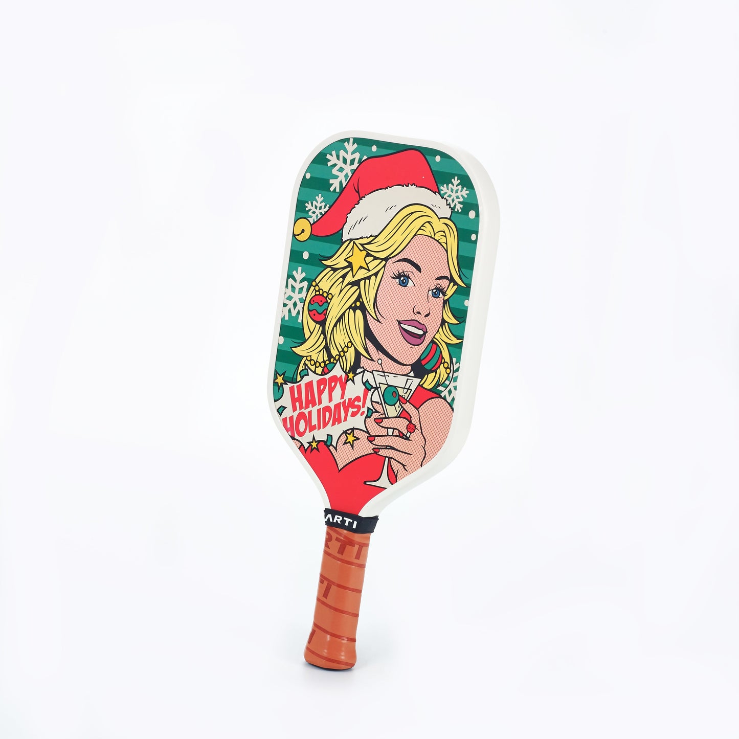 The ARTI Carbon Fiber Kristen&Kristy "Happy Holidays" Paddle features a comic-style blonde woman in a Santa hat with a drink, “Happy Holidays!” text on green snowflakes, and a brown handle—part of the ARTI Kristen&Kristy collection.