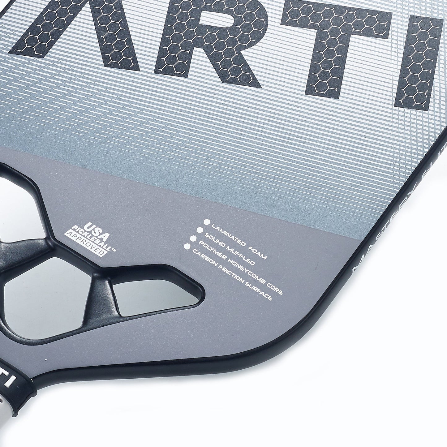Close-up of the ARTI Carbon Fiber "MASTERY ELITE 1.0" pickleball paddle, featuring a honeycomb pattern, bold ARTI branding, layered foam, solid handle, polymer core, T700 carbon fiber surface, and “USA Pickleball Approved” text near the handle.