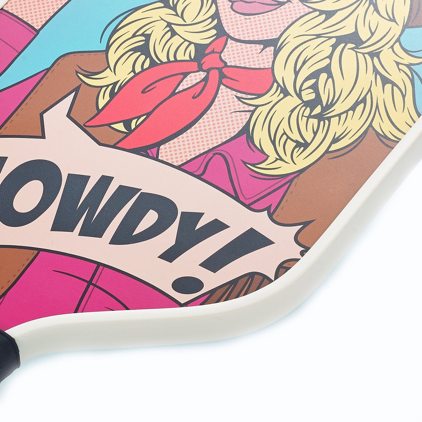 The ARTI Carbon Fiber Kristen & Kristy "HOWDY" Paddle by ARTI features a vibrant illustration of a blonde woman in Western attire with a red neckerchief, pink shirt, and brown jacket, holding a “HOWDY!” banner on a light blue background. USAPA approved.