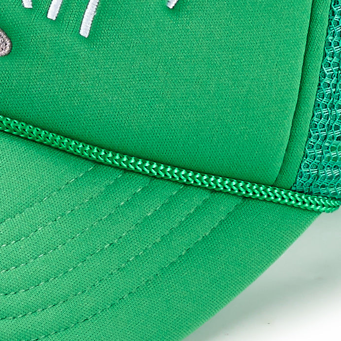 Close-up of the Ain’t No Party Like ARTI Trucker Hat by ARTI, featuring a green curved brim, mesh back, partial white embroidered logo, and visible stitching that highlights the bright, clean, lightweight sports fabric.
