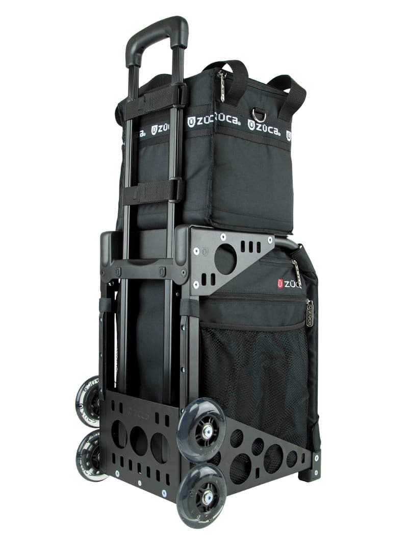 A black ZUCA rolling bag with sturdy metal frame, telescoping handle, two spacious compartments, mesh pocket, and four wheels—great for easy stair climbing. Pair with a ZUCA Cooler or ice packs. Visible ZUCA branding.