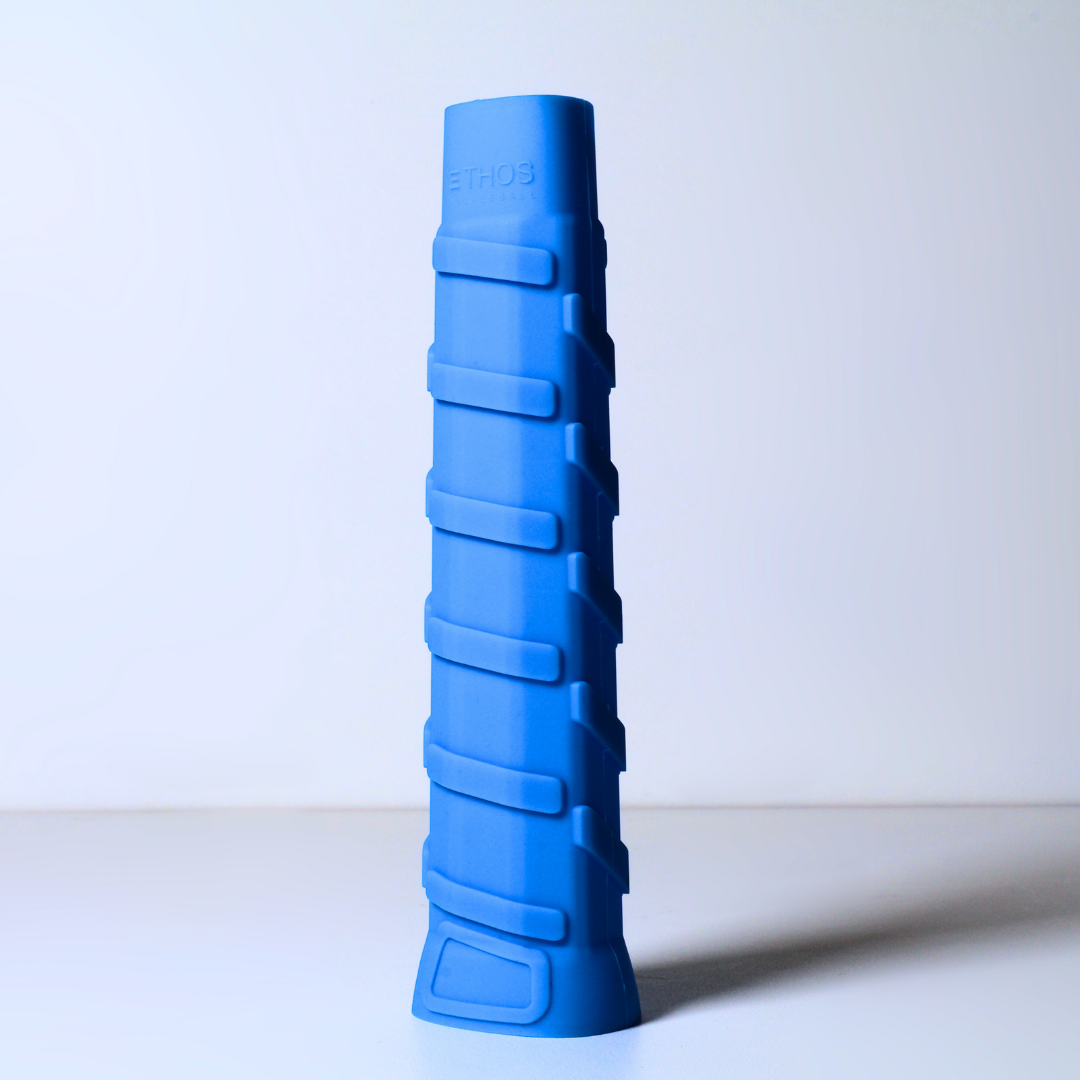 An Ethos Pickleball Ethos Pro Undergrip RH-LW, a blue, cylindrical, right-hand specific grip with vibration-reducing features and horizontal ridges, stands upright on a plain white surface with "ETHOS" embossed near the top.