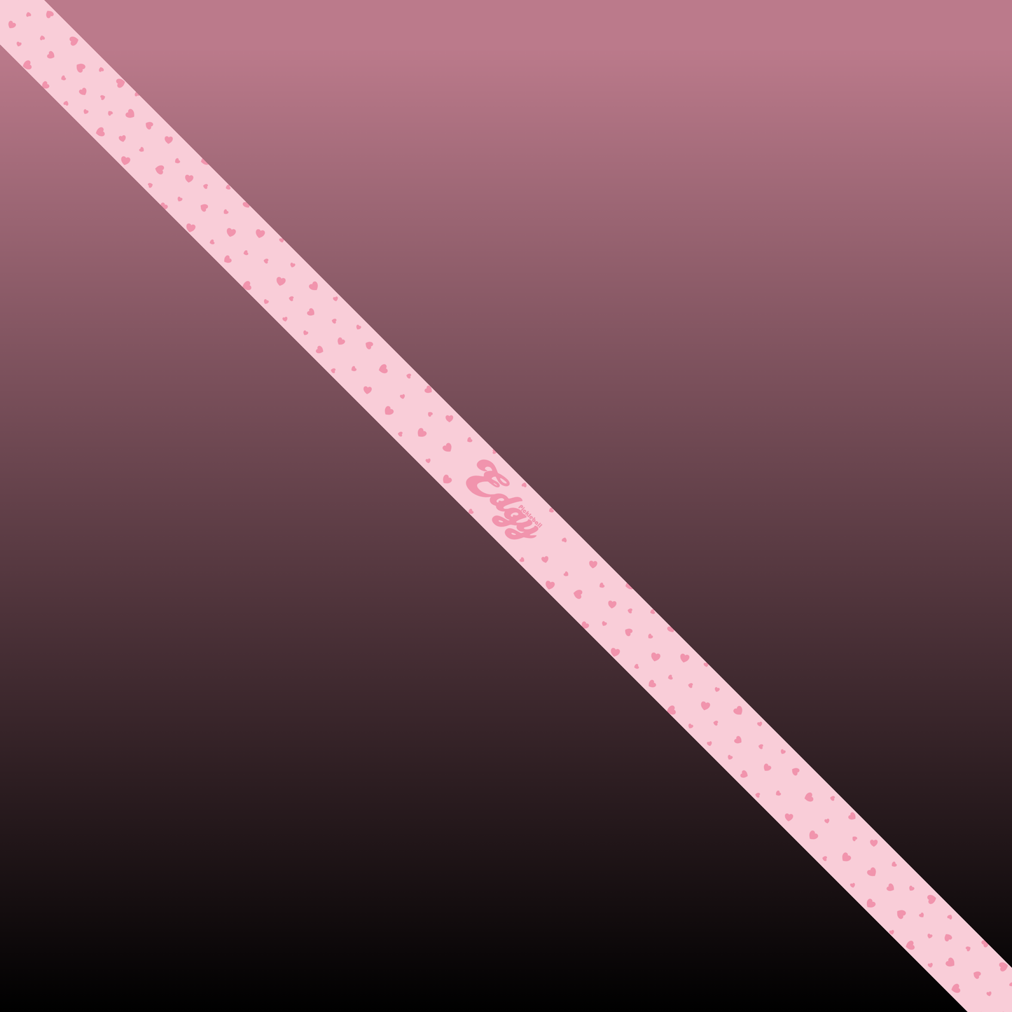 The Mini Hearts Edge Tape (3 pack) by Edgy Pickleball features a cute pink pencil with mini hearts running diagonally across a pink-to-black gradient. "Cutie" is written in pink bubble letters near the center of this fun paddle edge tape.