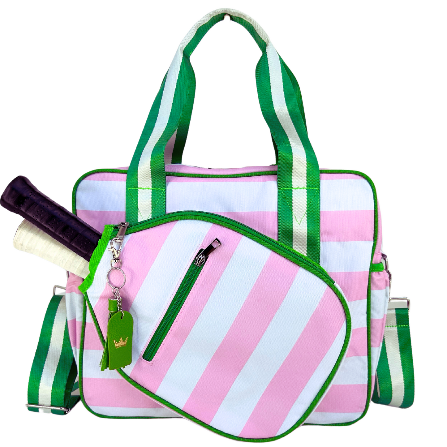 The Queen of the Court Prepster Pickleball Bag features pink and white vertical stripes, green trim, green-and-white striped handles, a side pocket for your racket secured by a green zipper, and a cute green keychain.