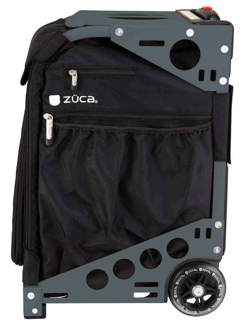 The ZUCA Pickleball Pro Black/Black rolling bag features a sturdy metal frame with circular cutouts, two zippered pockets, mesh side pocket, visible wheel, and a white ZUCA logo printed near the top pocket on black fabric.