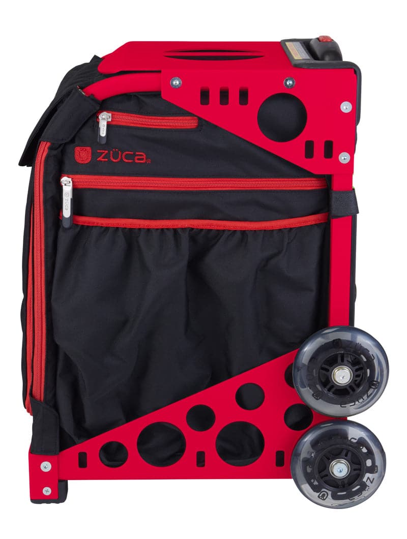 The ZUCA Pickleball Sport Black/Red bag stands upright, featuring a sturdy red frame with circular cutouts, two large clear wheels, and a black fabric bag with zippered pockets for organized pickleball gear storage.