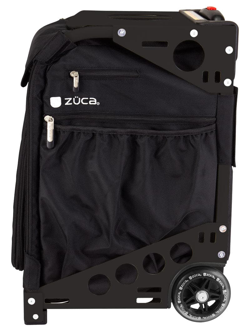 The ZUCA Pickleball Pro Black/Black rolling bag stands upright, showcasing a sturdy metal frame with circular cutouts, dual zippered pockets, mesh side pocket, and visible wheel. The white ZUCA logo appears on the upper pocket—ideal for organized pickleball gear storage.