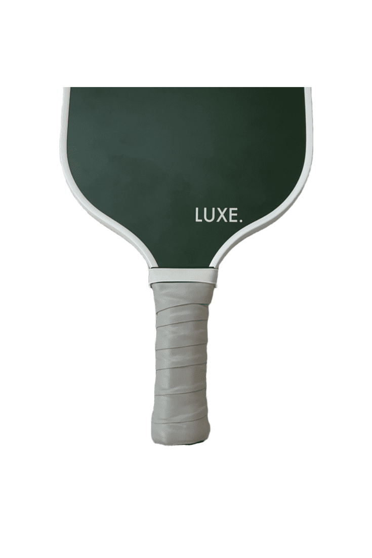 A dark green LUXE Pickleball paddle with white edges and “LUXE.” in white on the face. The handle has light gray Pickleball Paddle Grips for comfort. Plain white background.