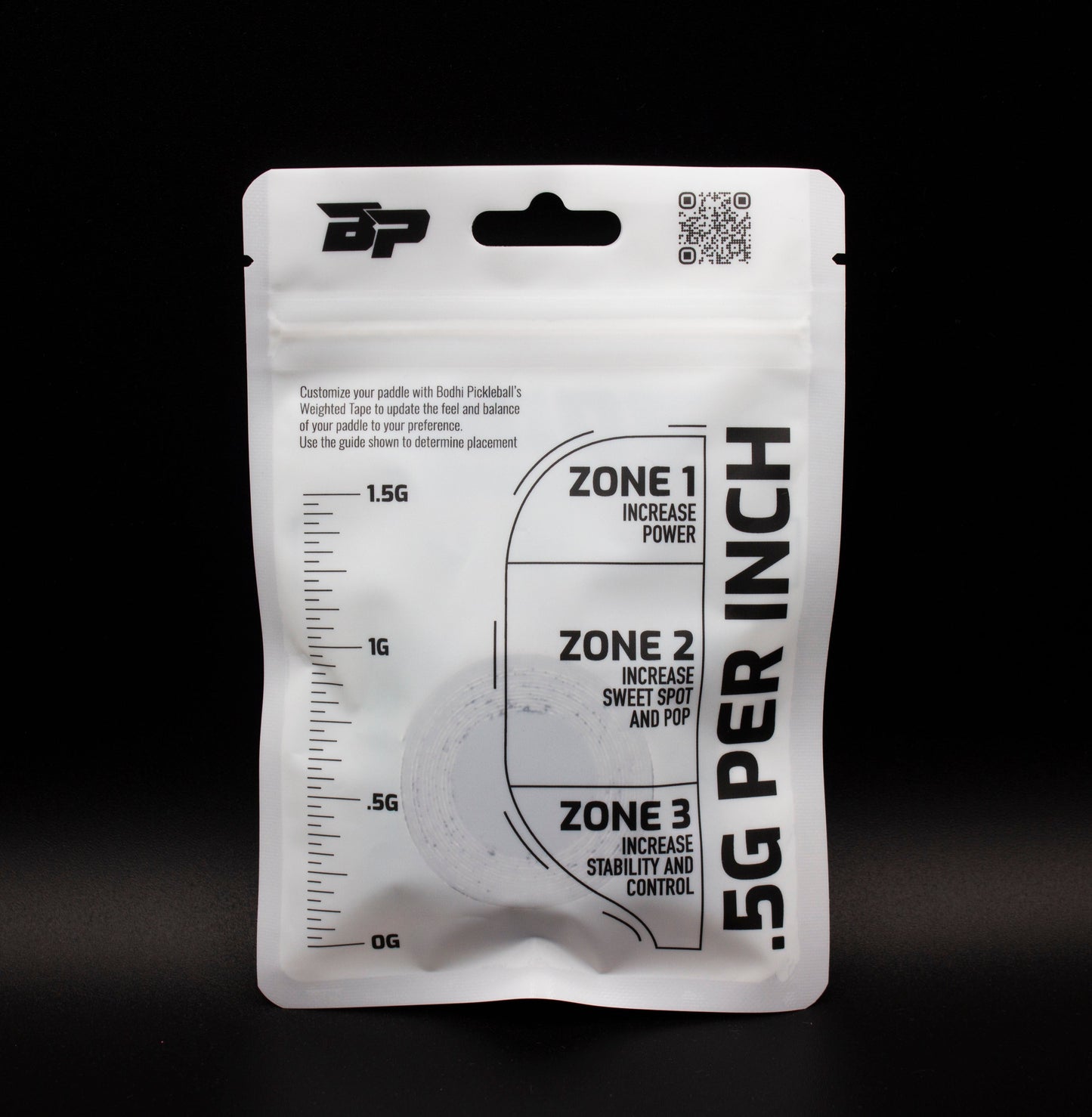 A resealable white pouch labeled “.5G PER INCH” features a vertical ruler, three paddle customization zones, BP logo, QR code at the top, and contains Bodhi Performance PROtune™ Weighted Tape for optimal paddle performance.