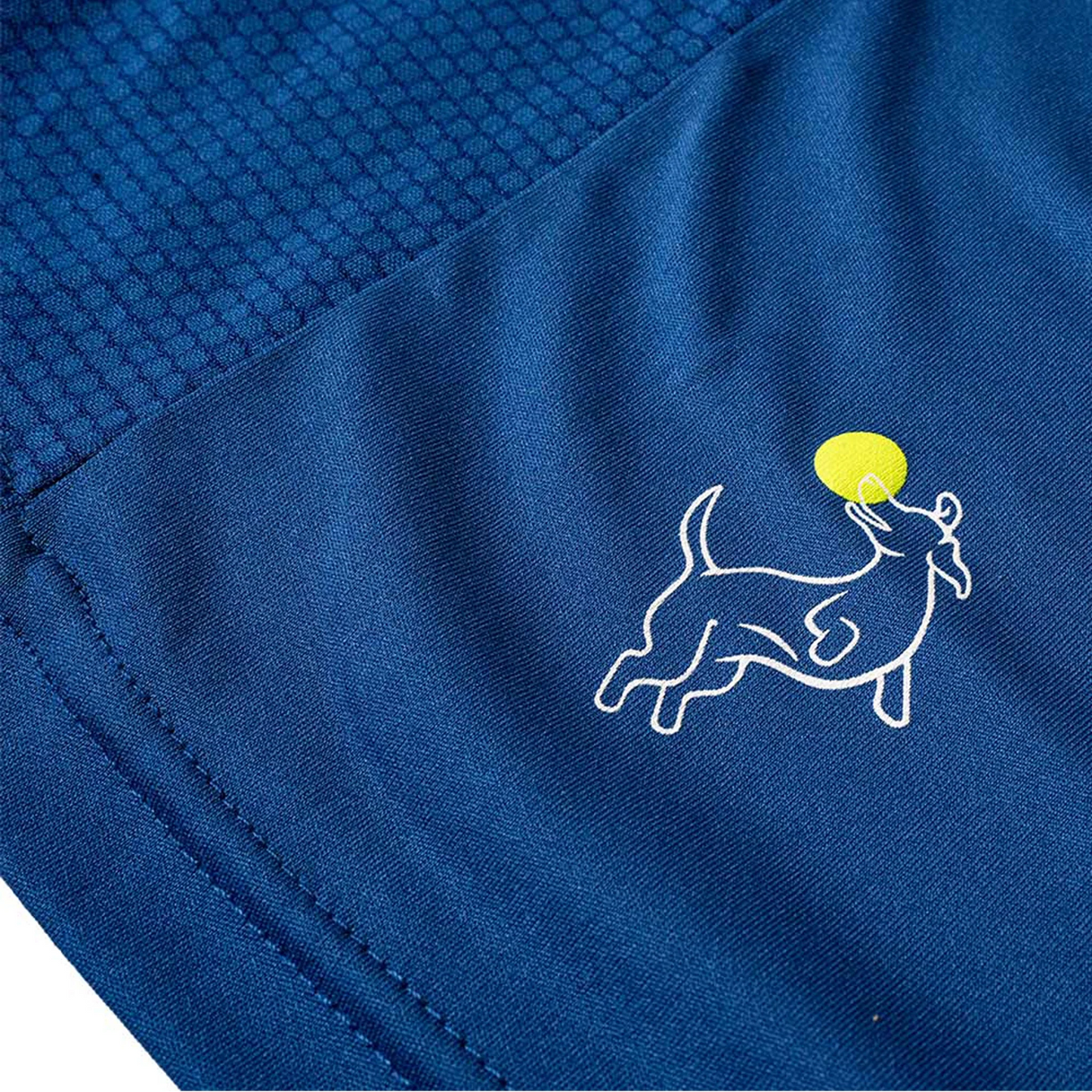 Close-up of Swinton Pickleball's Men's Kitchen's Closed Performance Shirt in royal blue, featuring a small square pattern and a white outline of a dog jumping for a yellow tennis ball. Smooth, moisture-wicking fabric keeps you comfortable.