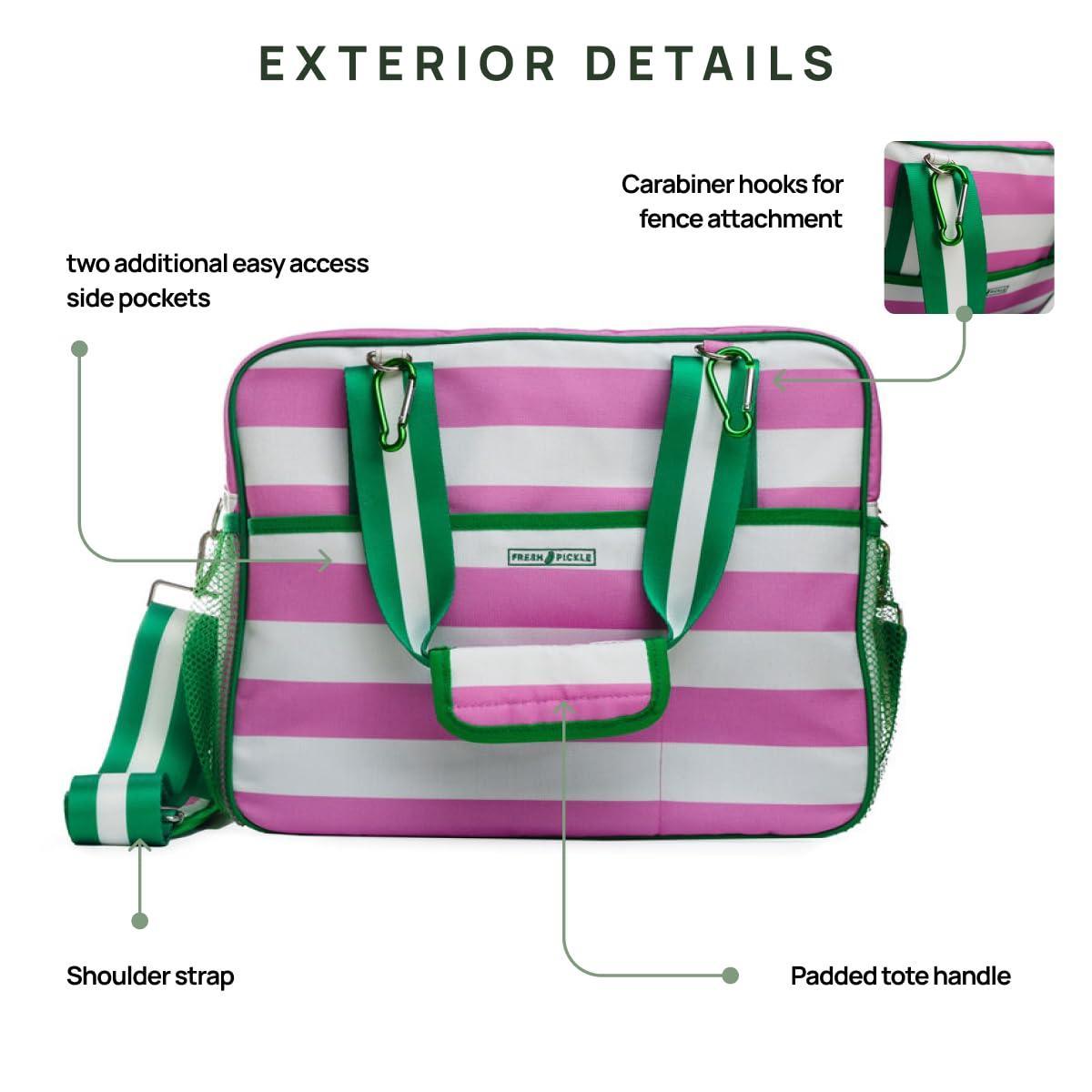 The Fresh Pickle Lola Pickleball Tote Bag is shown in pink and white stripes with green accents. Labels highlight its shoulder strap, padded tote handles, two mesh side pockets, and carabiner hooks for fence attachment.
