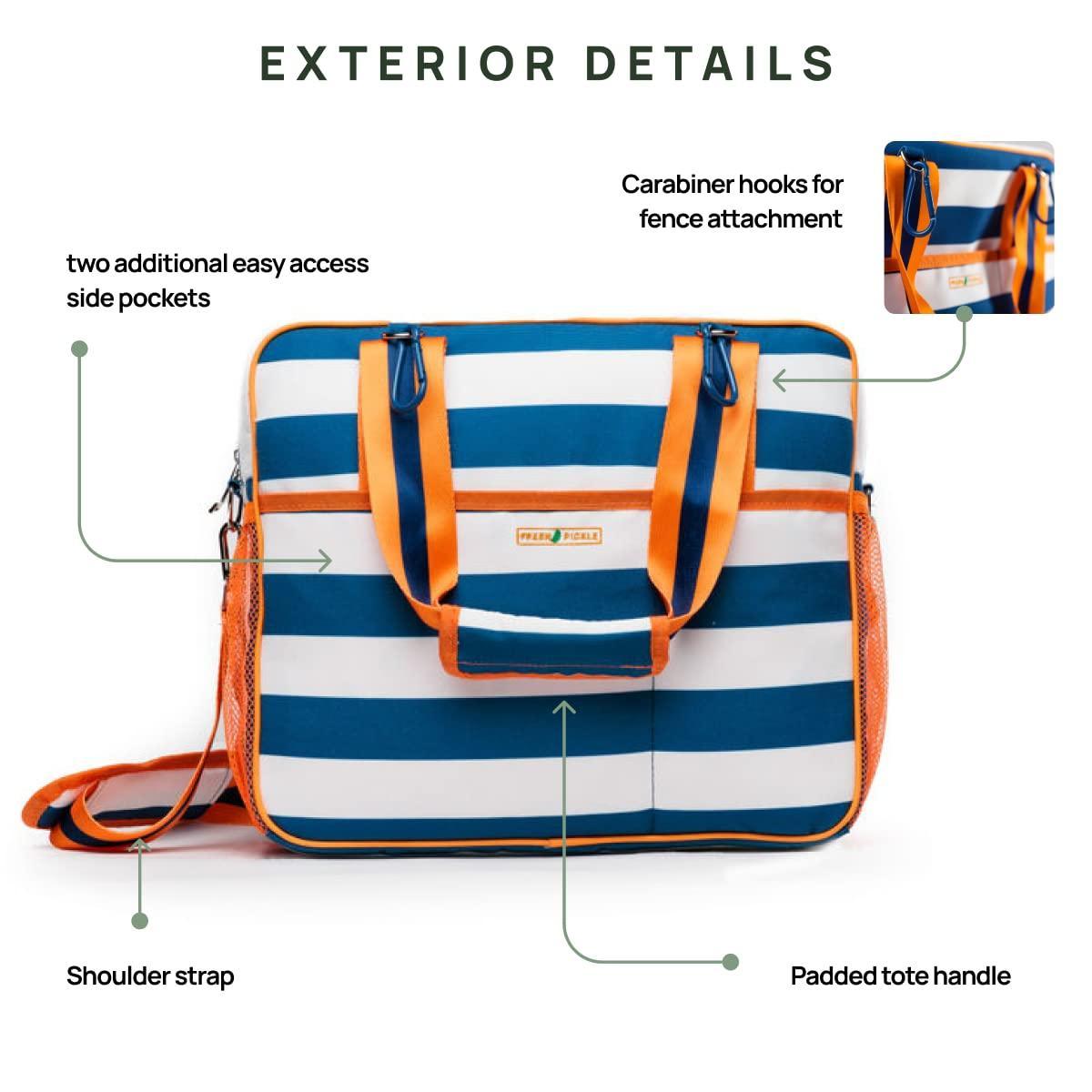The Fresh Pickle Lola Pickleball Tote Bag features blue and white stripes, orange handles, a shoulder strap, padded tote handle, two side mesh pockets, carabiner hooks for gear, with labeled exterior details for pickleball enthusiasts.