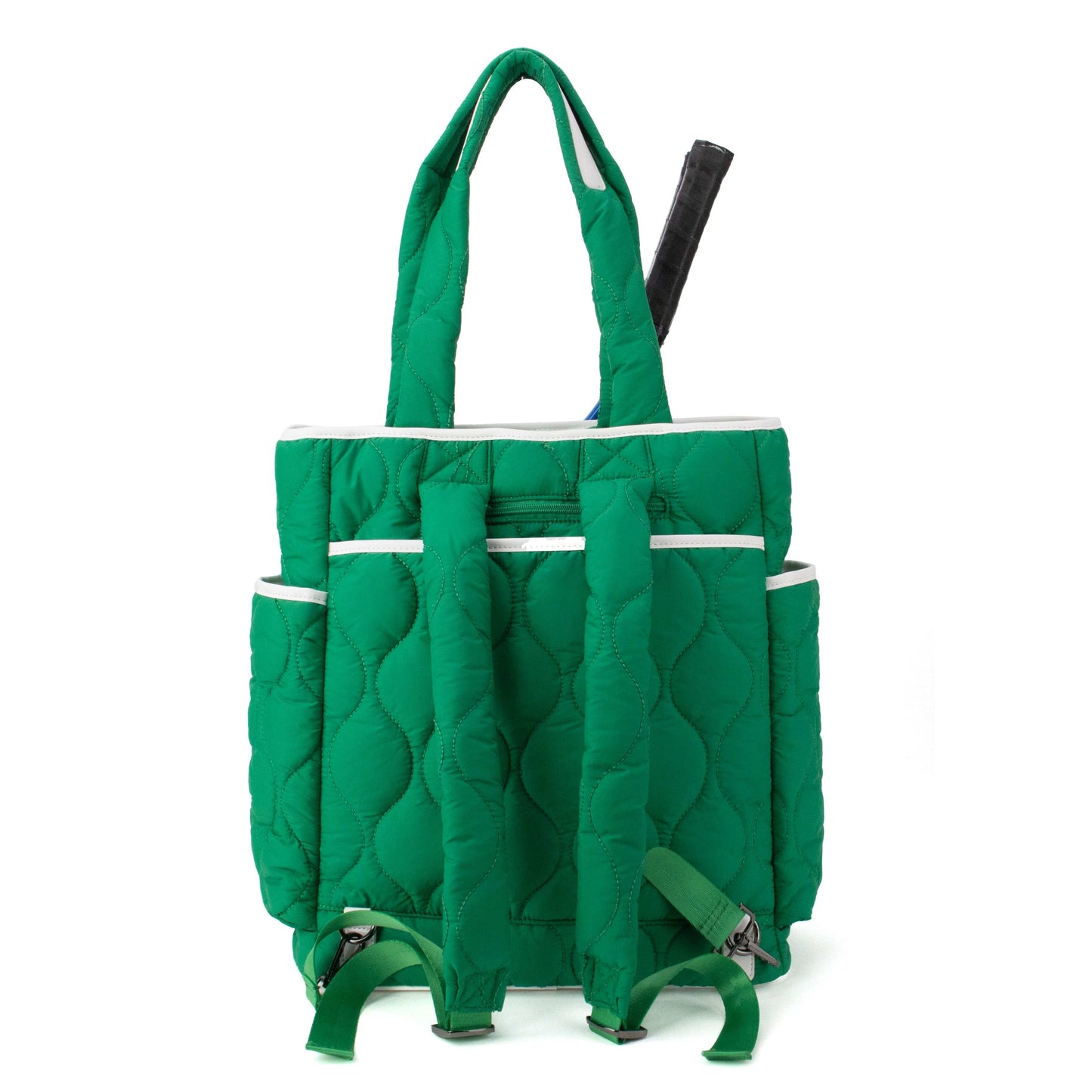 The Queen of the Court Fifth Ave Pickleball Convertible Tote Bag/Backpack is green with white trim, a quilted padded texture, two shoulder straps, side pockets, and a tennis racket handle sticking out. Shown on a plain white background.