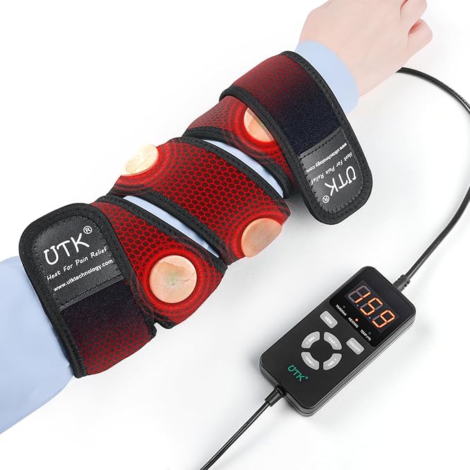A person’s forearm is wrapped in an iReliev Far Infrared Heating Pad Wrap with Far Jade, featuring black, red, and orange heating elements. The device connects to a digital controller reading “059.” The person wears a light blue shirt.