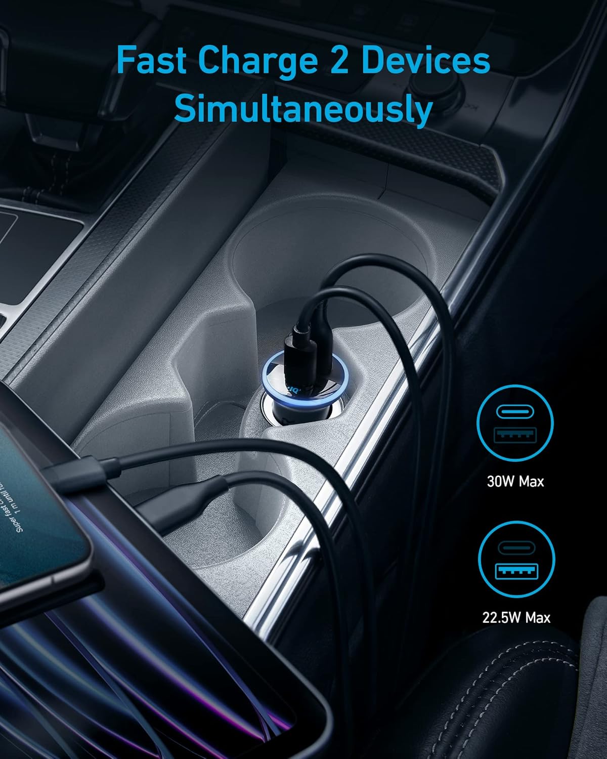 Anker 323 Car Charger (52.5W) powers two devices at once—30W Max USB-C and 22.5W Max USB-A ports—with a blue LED ring glowing while charging in your car’s center console. Text above: Fast Charge 2 Devices Simultaneously.