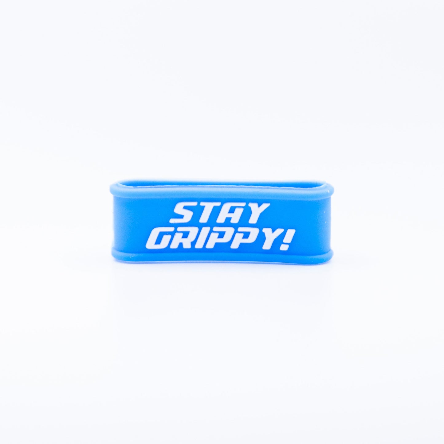 The Bodhi Performance Paddle Bands are blue silicone grip bands with bold white “STAY GRIPPY!” text, designed to upgrade your pickleball paddle grip. Shown here: a rectangular band with rounded edges on a plain white background.