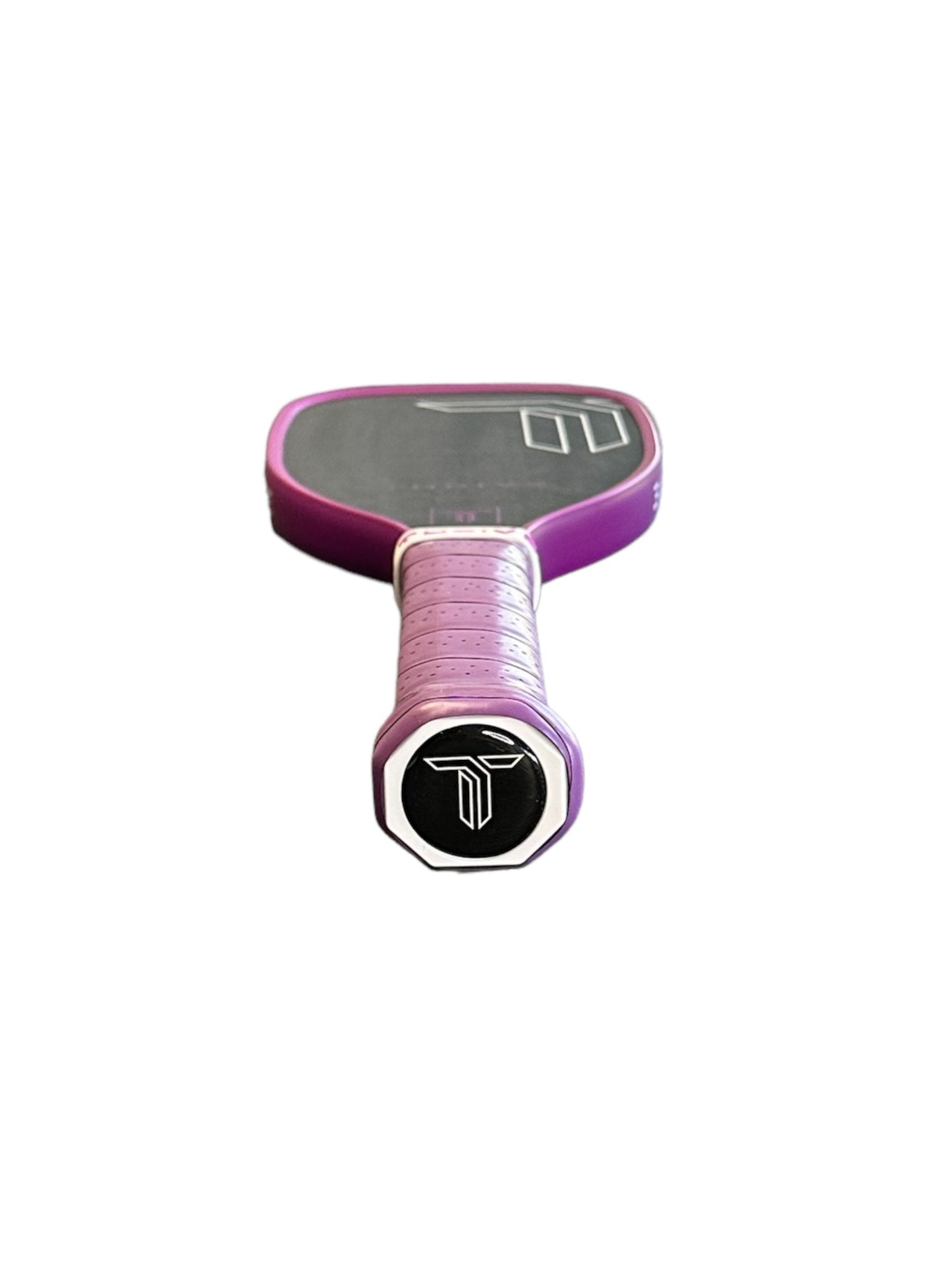 The Thrive Pickleball Training Paddle (Purple) has a black grip, a white geometric logo on the handle end, and features a T700 carbon fiber face with a white outlined design on a white background.