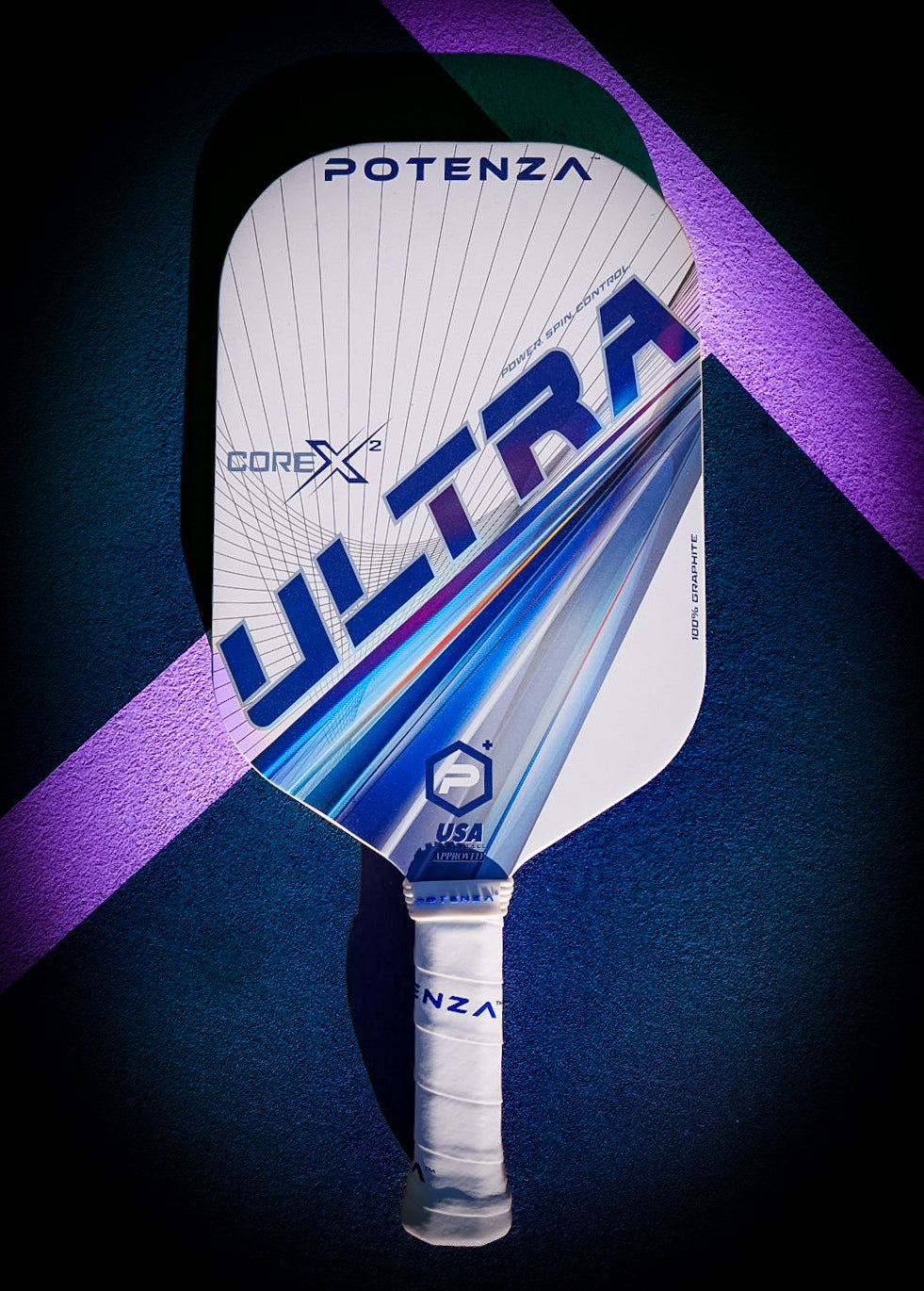 A white Potenza Pickleball ULTRA+ COREx2 paddle with blue and gray lines rests on a court over purple diagonal stripes. The handle has white grip tape, and “USA Pickleball Approved” is printed near the base.