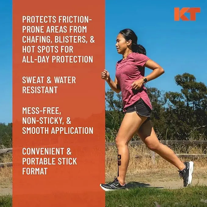 A woman in athletic wear runs on a dirt path with trees and sky. To the left, text features KT Tape’s KT Health Chafe Safe™ Anti-Friction Balm: protects from chafing/blisters, sweat and water resistant, smooth application, portable.