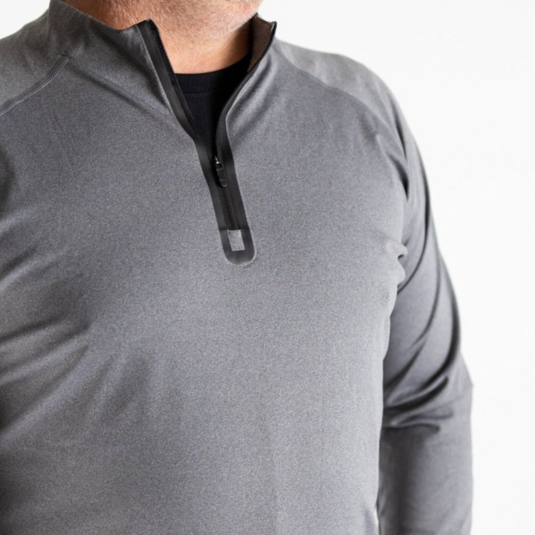 A man wears the DYM Athletics Top-Notch Men's 1/4 Zip—a light gray, long-sleeve pullover—over a black shirt, with the black zipper partially unzipped. Image is cropped waist-to-shoulders against a plain white background.