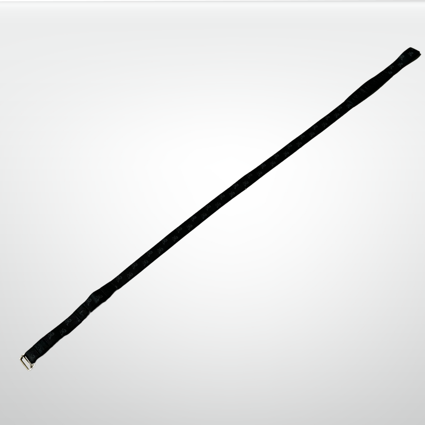 The iReliev I AM Leather Monogram Yoga Strap, a sleek black leather strap with a silver metal buckle, is laid diagonally on a light gray background, showcasing luxury and style perfect for high-end fitness routines.